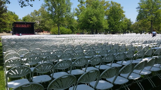 Rows of empty chairs in front of the Commencement stage