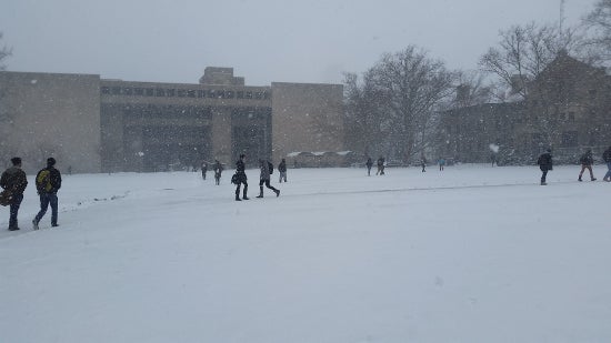 Students walks through Wilder bowl in the snow