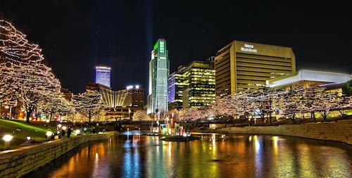 Downtown Omaha at night with lights.