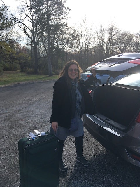 My mom arriving to Oberlin and taking a suitcase out of her rental car