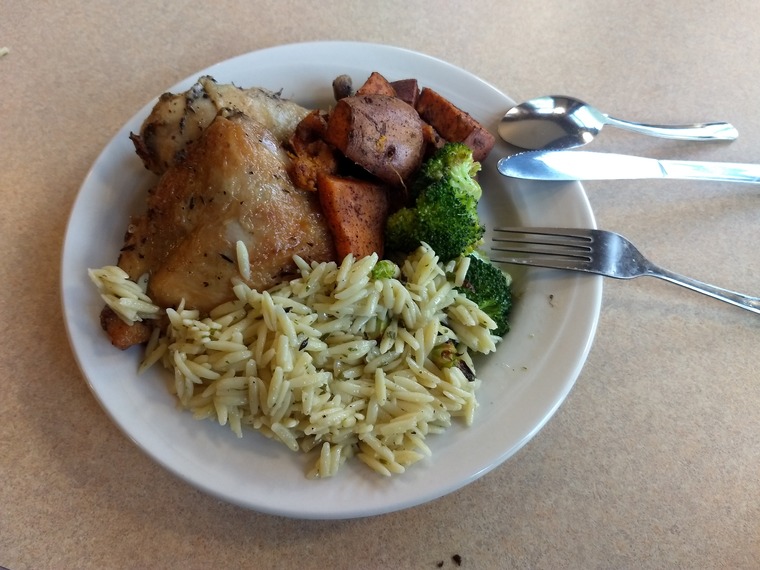 A plate of chicken and orzo