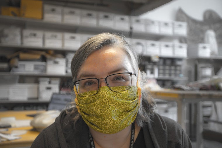 Woman wearing a surgical face mask.