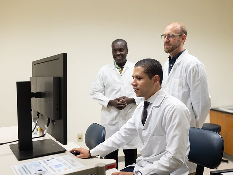 Gunnar Kwakye, Marwan Ghanem, and Chris Howard in a lab.