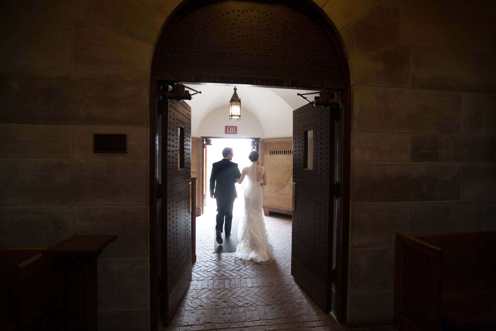 A newly wed couple exits the Chapel