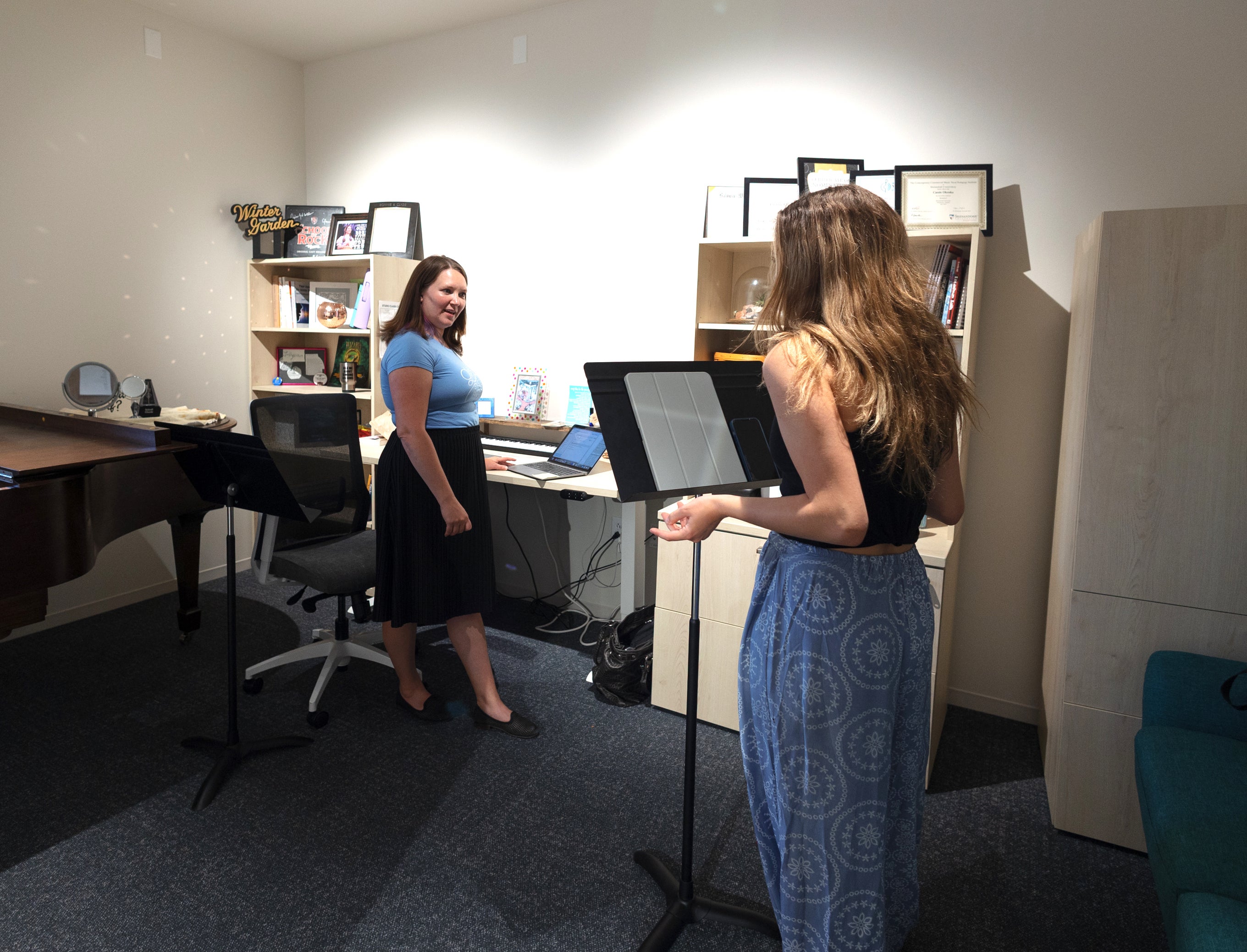 student taking singing lesson in a faculty studo.