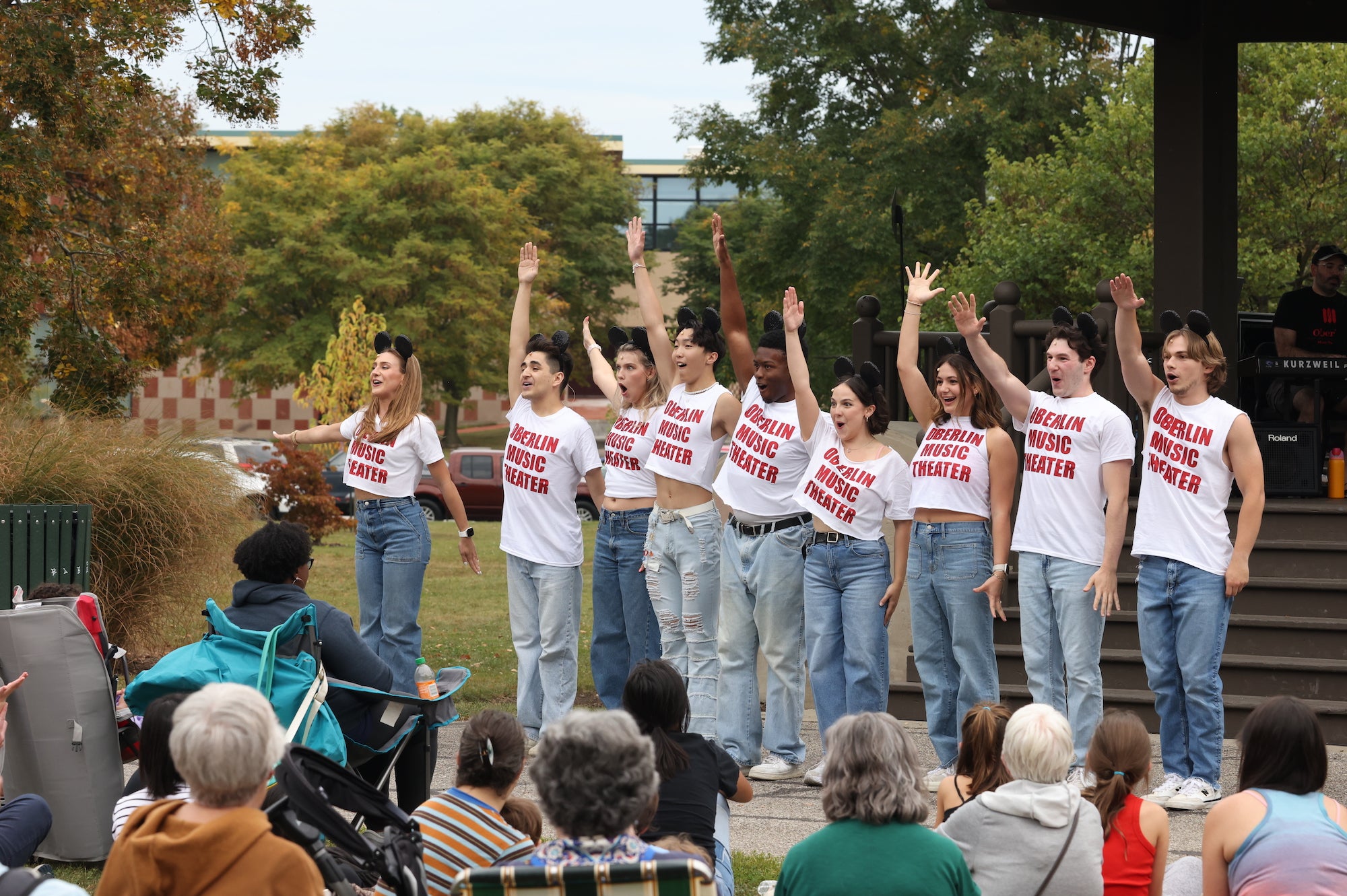 singers cheerfully performing outdoors.