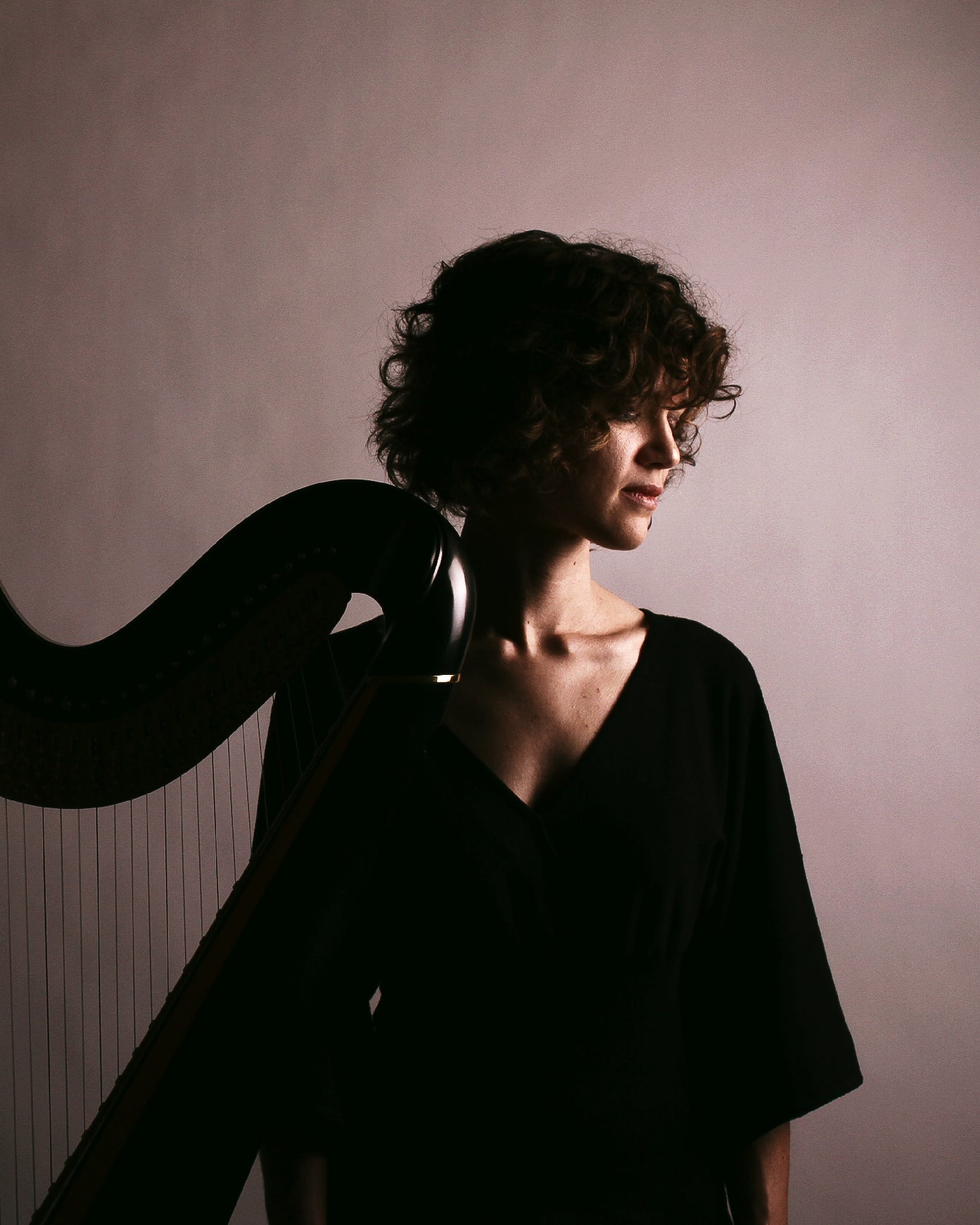 Portrait of artist with harp