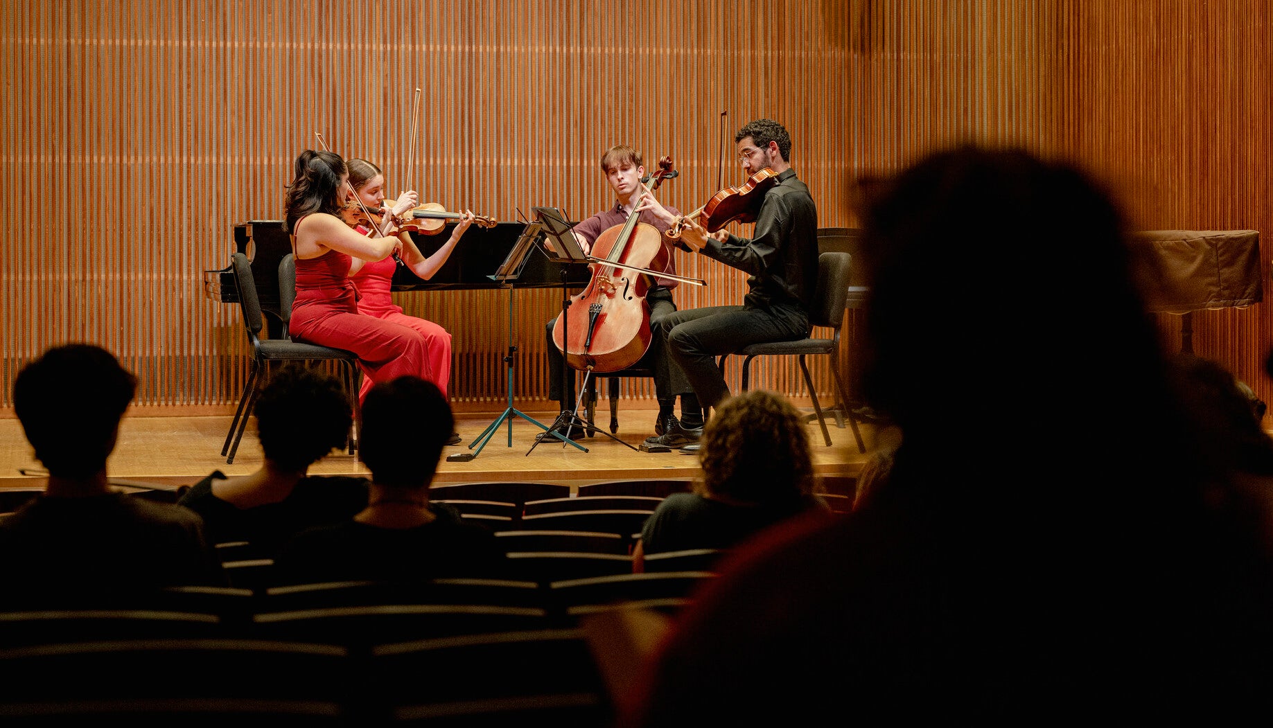 string quartet performs at masterclass on stage