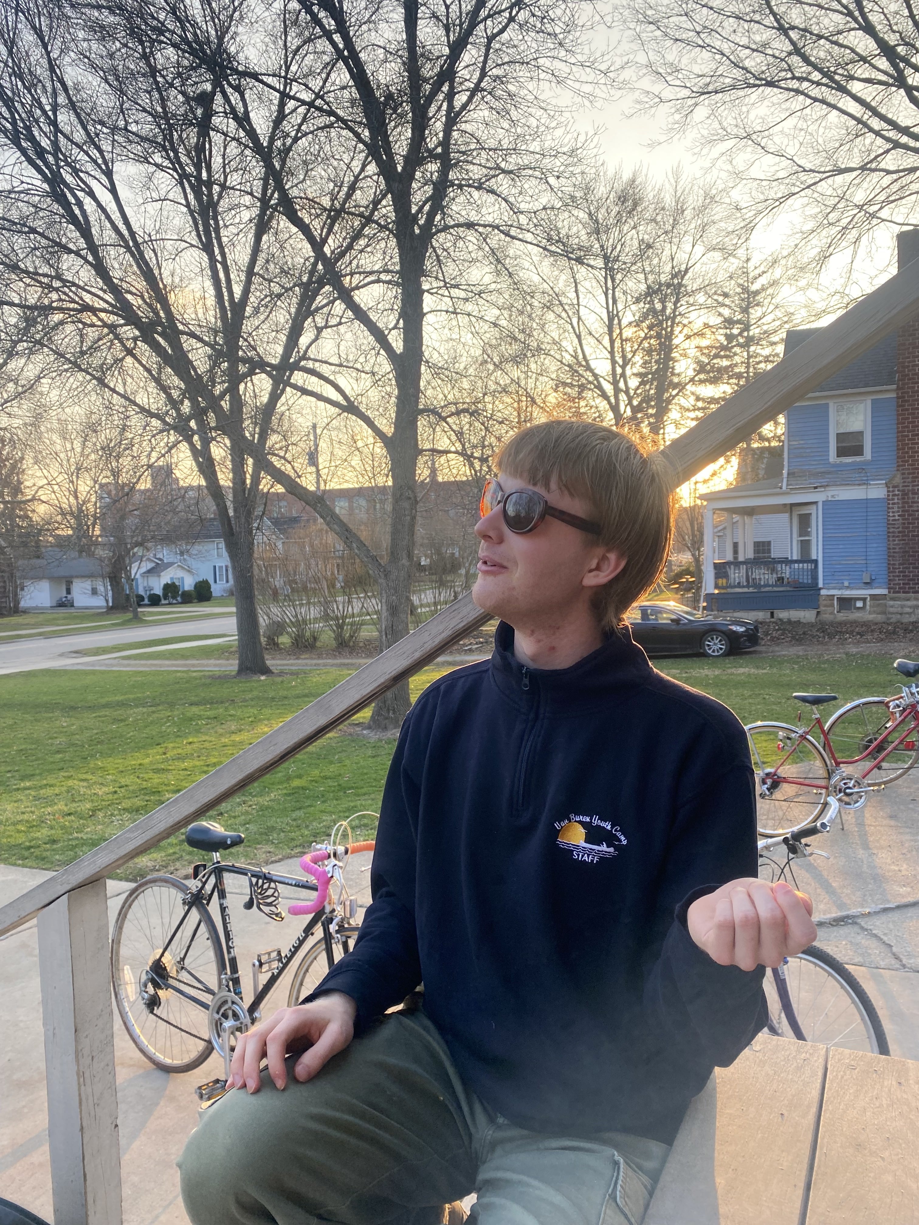 Eric wearing my glasses, face tilted away