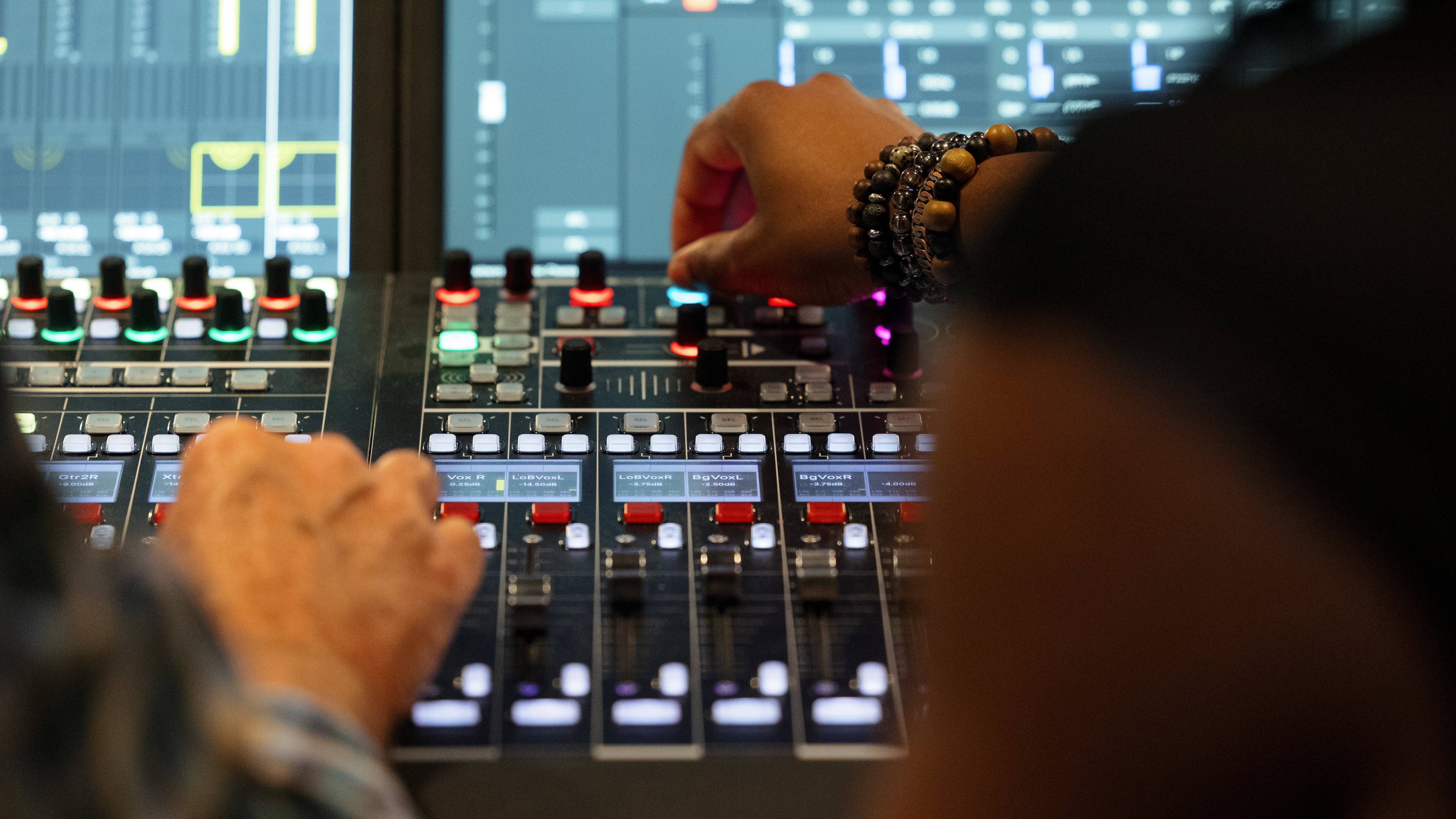 Mixing booth close up image with hands and board