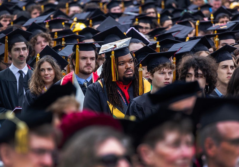 students watching commencement proceedings.