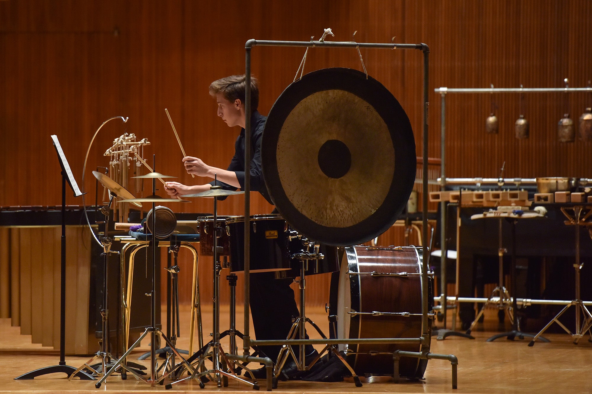 Percussion student performs with the Contemporary Music Ensemble in Warner Concert Hall.