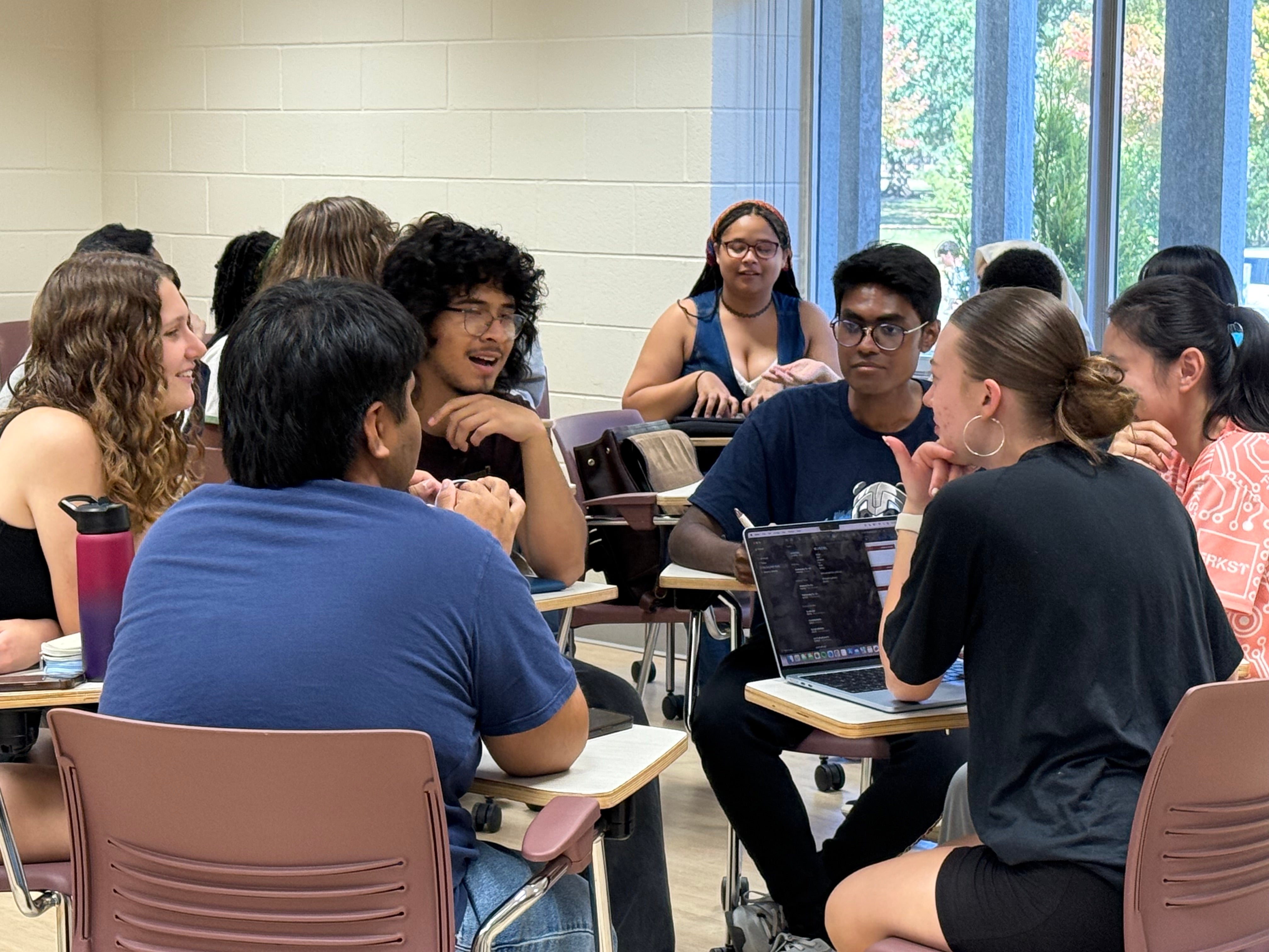 A group of students work together on a project in LEAD 110