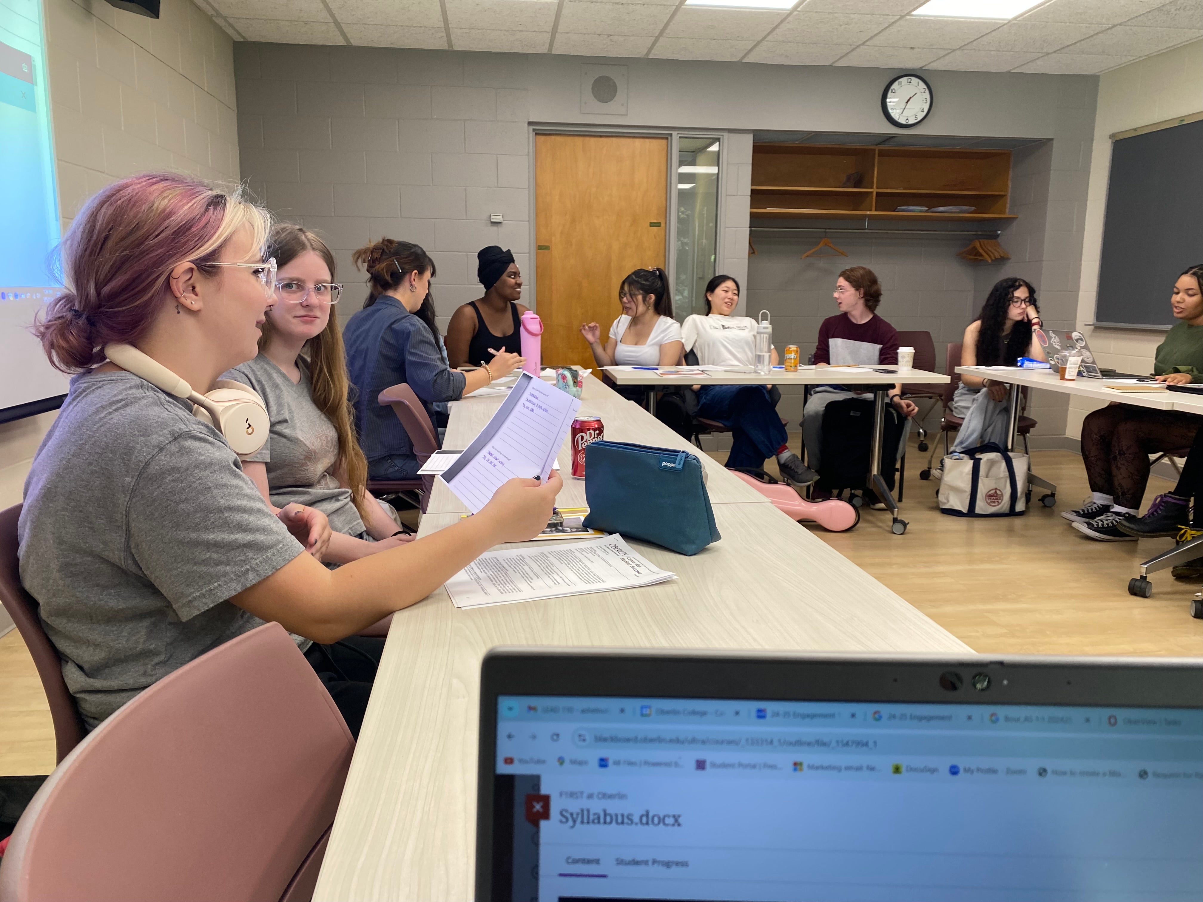 A photo of Scholars in the LEAD 110 class around the tables.
