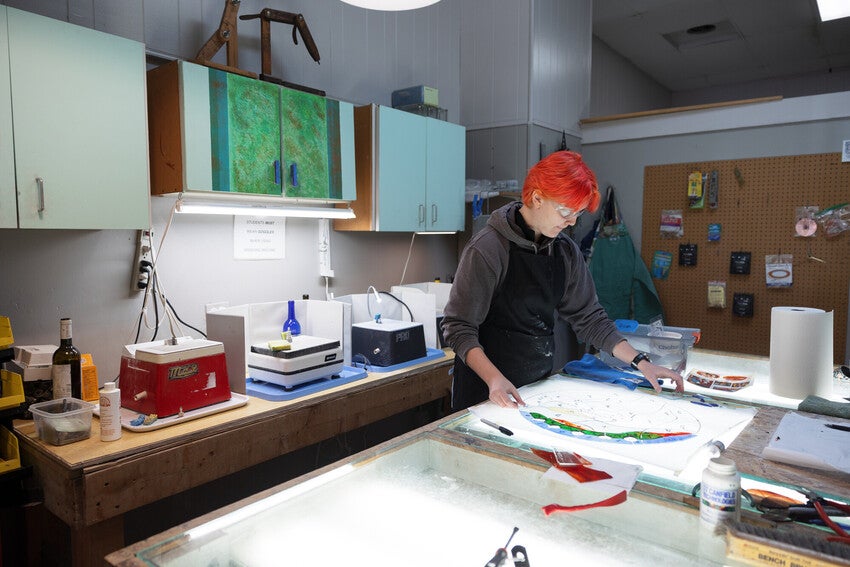 Oberlin student Vivian Adkins works on a stained glass project during her Winter Term Micro-Internship at Verite Stained Glass Inc.