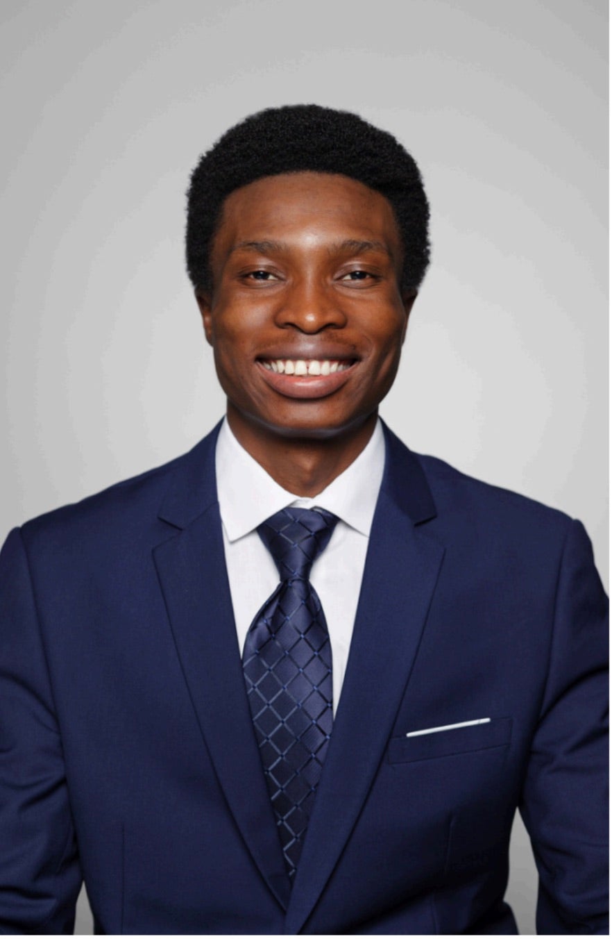 Headshot of Menard Simoya
