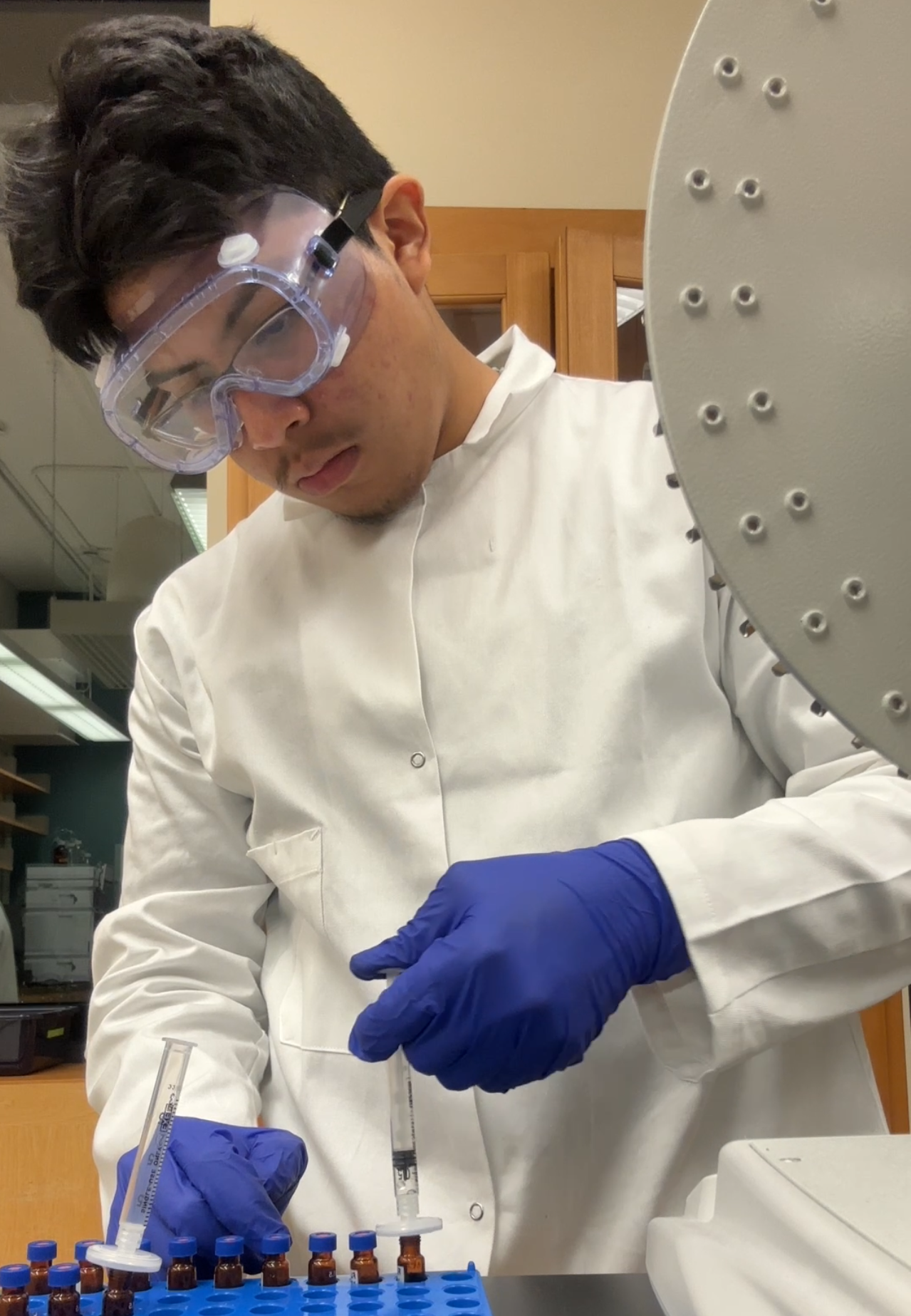 Miguel Romero conducts experiments in the Bowers Lab