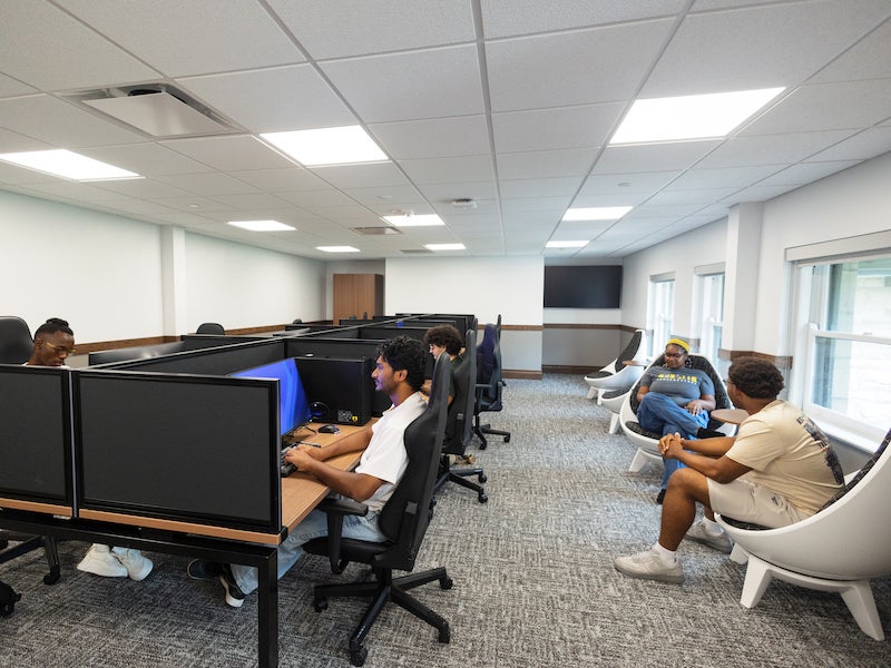 students gaming in an esports arena.