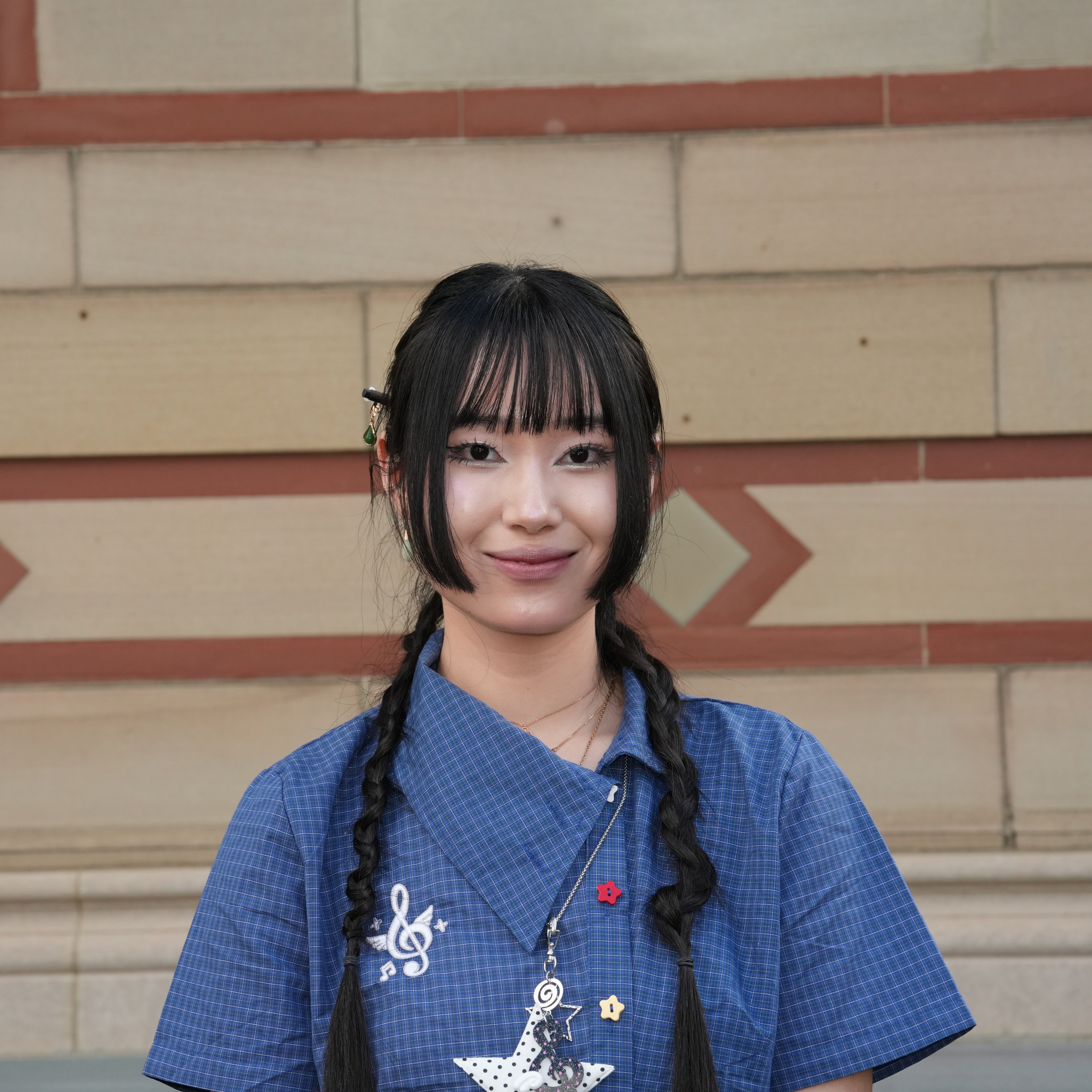 A headshot of a female student with long black hair.