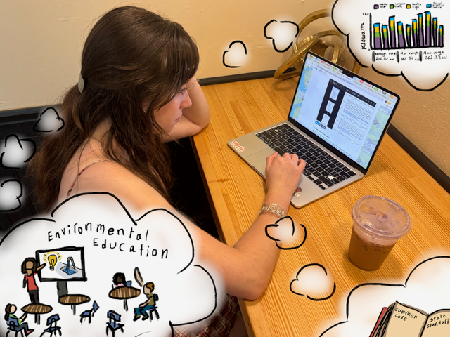 Rayna Moxley working at a laptop.