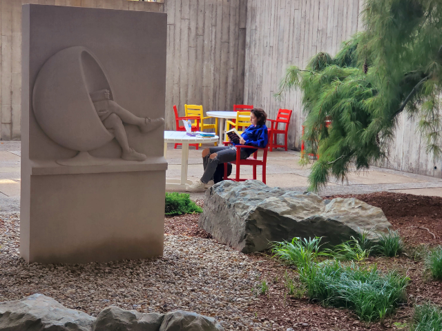 Reading outside near the contemplation garden lower level of Mudd