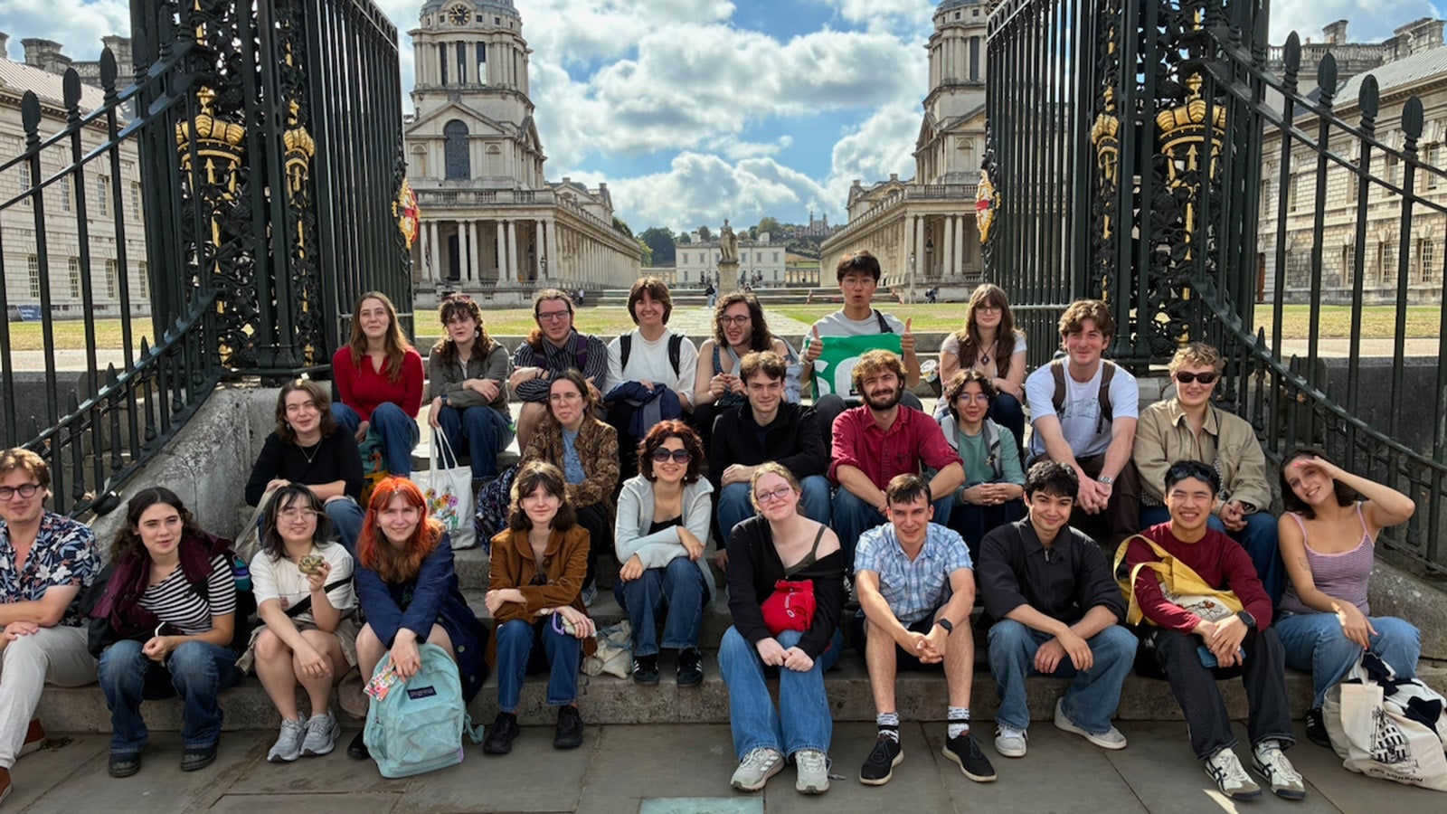 A group of English students posing for the camera.