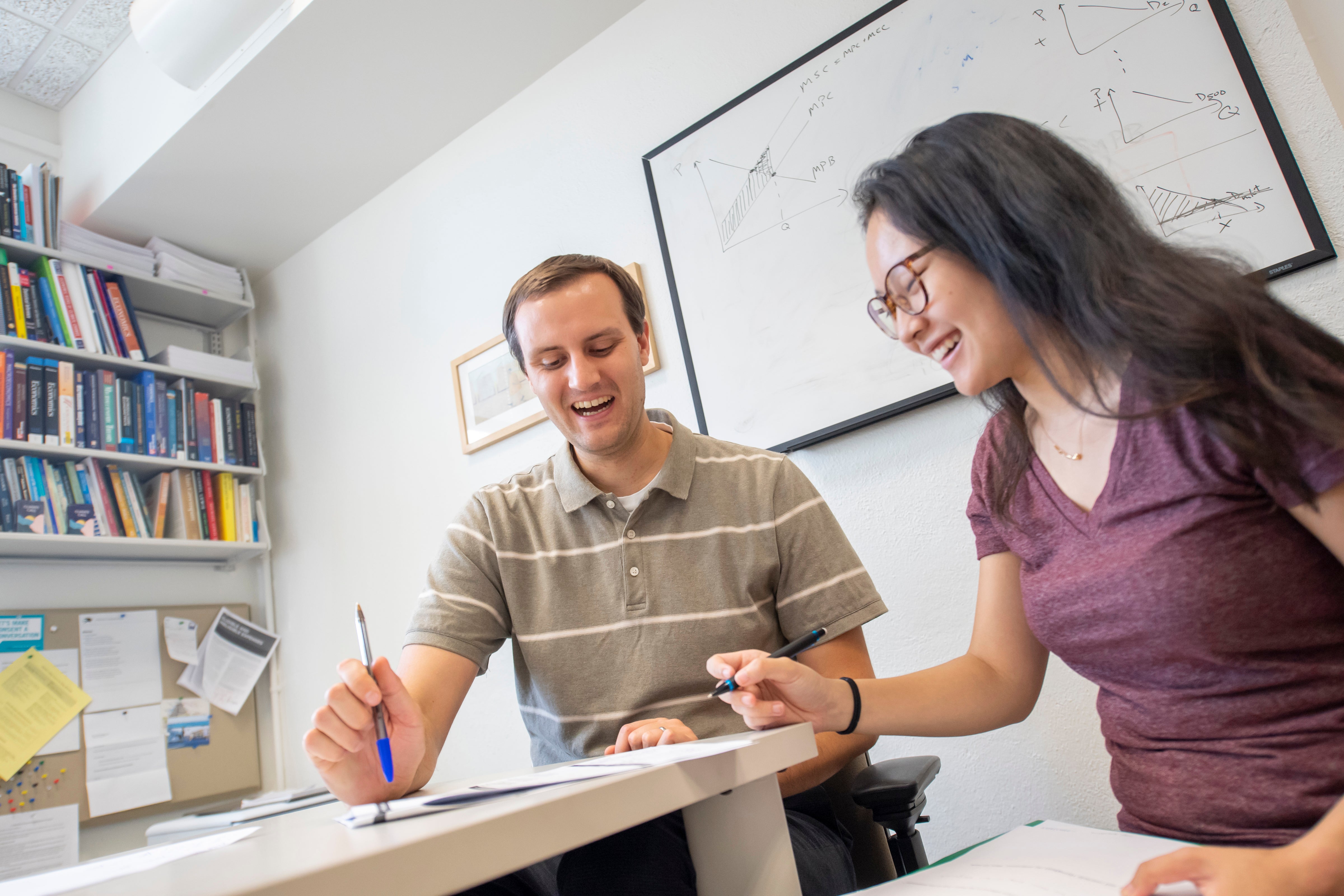 An Oberlin professor helps a student during office hours.