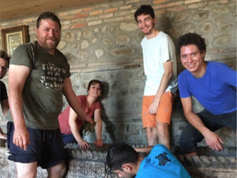 Intern Jean-Paul Gilbert crushing grapes in Georgia