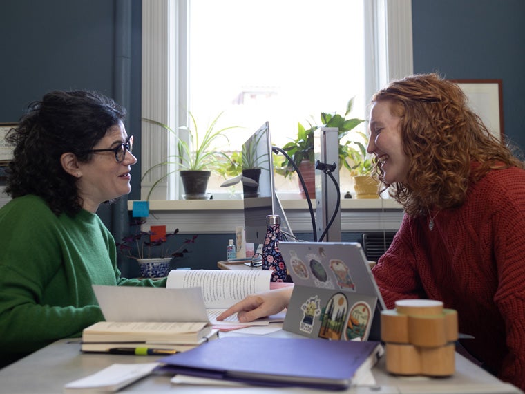 A student meets with a professor.