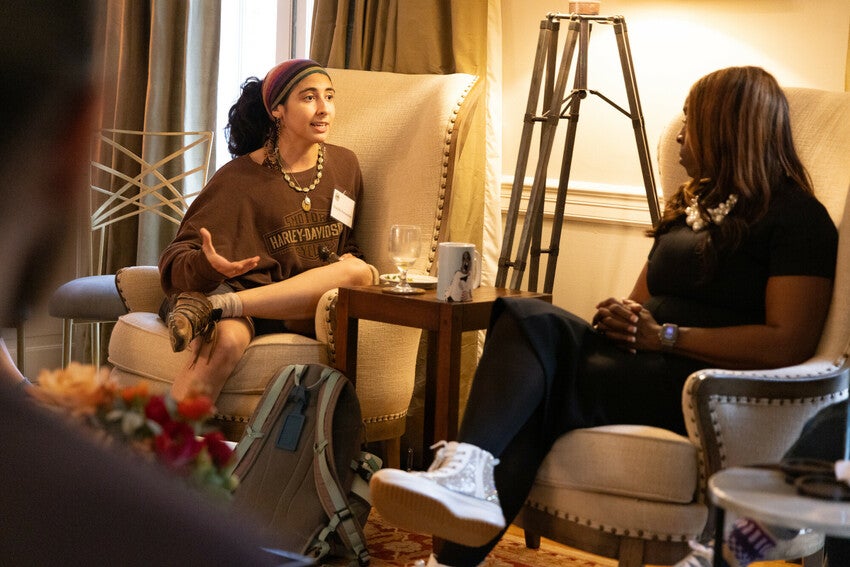 Barefoot students with President Ambar