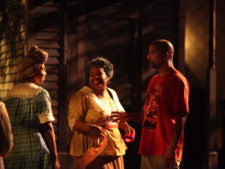 two actors and a director on stage