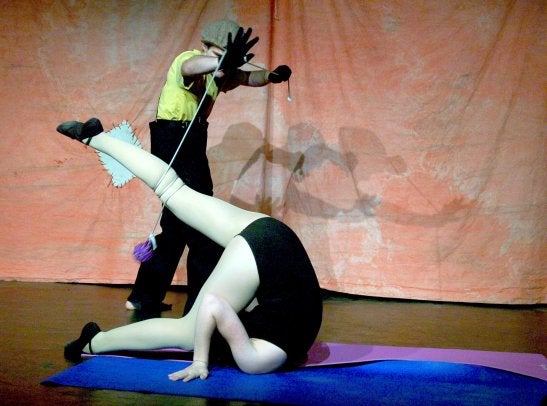 Two actors performing gymnastics