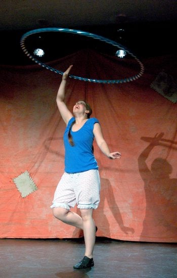 A performer hula hooping