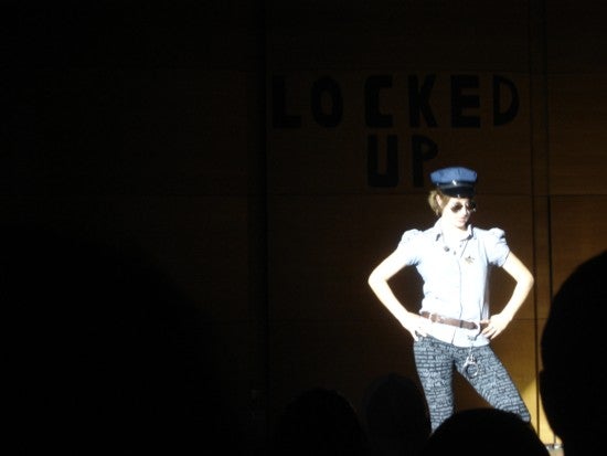 A performer dressed somewhat as a police officer.