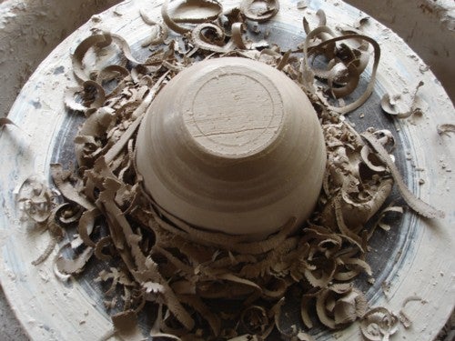 Clay pot on a pottery wheel 