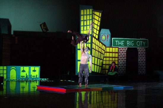  performer balances another with his hand