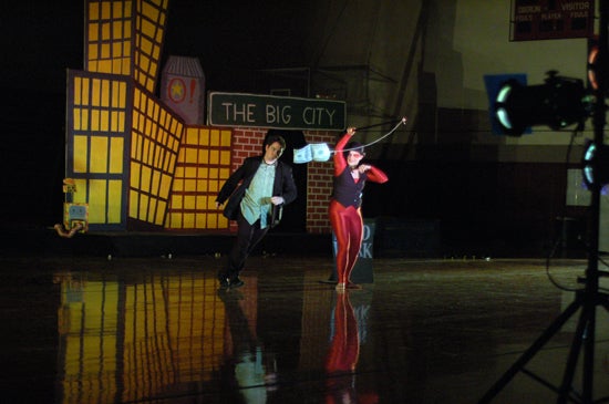 Two circus performers on the floor 