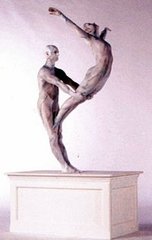 Sculpture of one performer holding up another