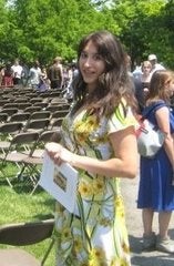 Aries wearing a yellow dress at Commencement