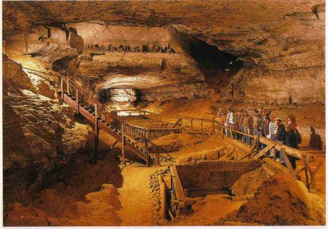 Painted depiction of the inside of large cave. A group of people stand at a built railing