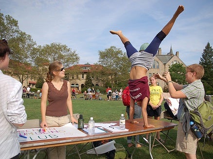 A table in Wilder bowl with someone doing a handstand on top of it