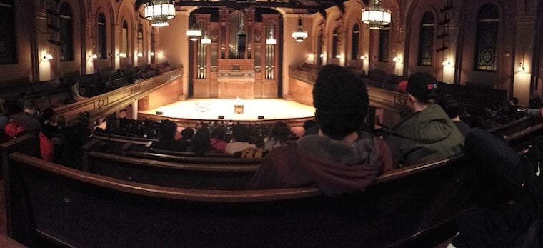 Students watch the stage in Finney pews 