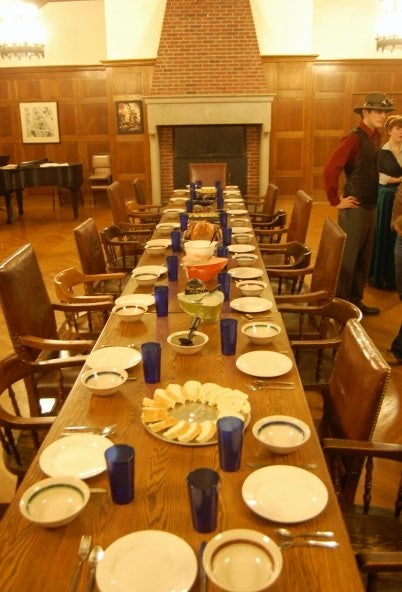  very long table with place settings 