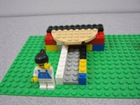 A lego structure with a lego person