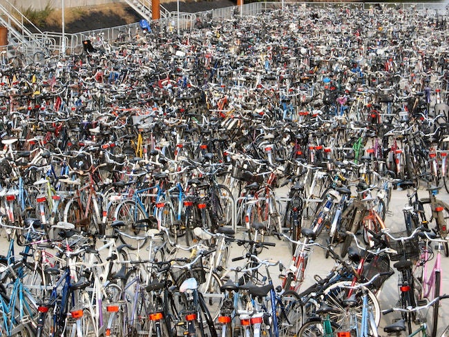 Bike racks filled with hundreds of bikes