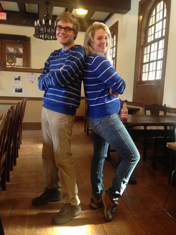 Two students posing with matching sweaters
