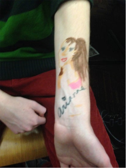 Marker drawing of a girl on an arm