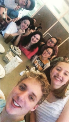 Group selfie at a dining table