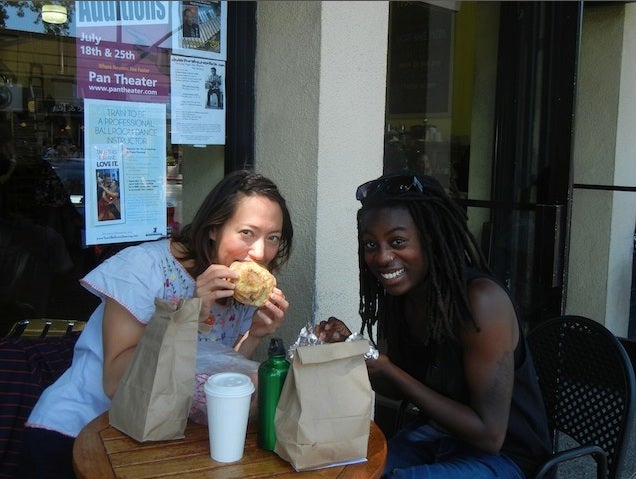 The author and a friend pose with their cheese rolls
