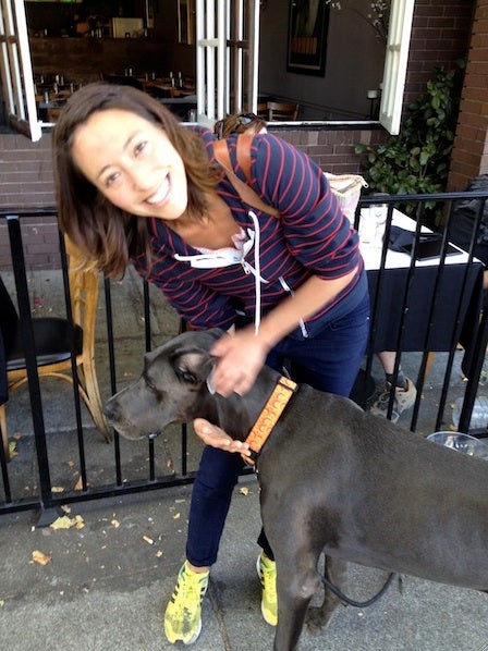 A woman poses with a great dane